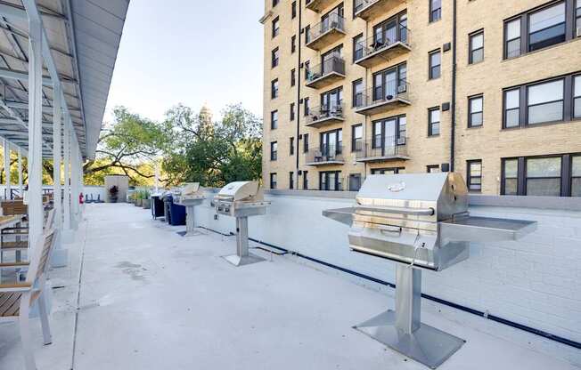 A large metal sculpture sits on a rooftop.