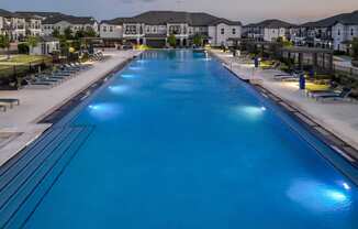 resort-inspired swimming pool at Reveal on the Lake apartments