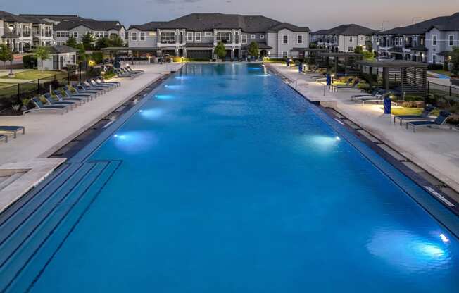 resort-inspired swimming pool at Reveal on the Lake apartments