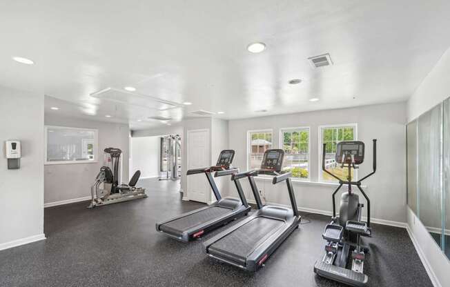 A spacious gym with treadmills and elliptical machines at Lexington on the Green, North Carolina