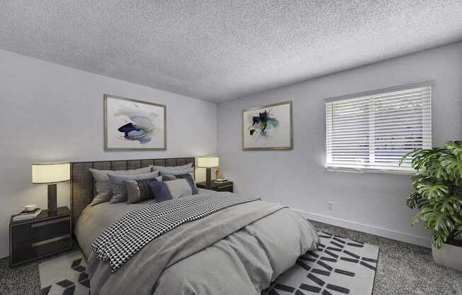 A bedroom with a large bed and a potted plant.