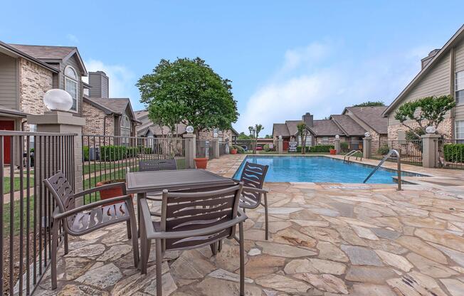 a couple of lawn chairs sitting on top of a building