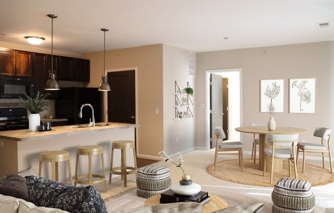 a living room with a kitchen and a dining room