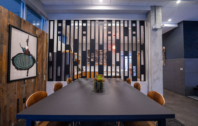 a dining room with a table and chairs