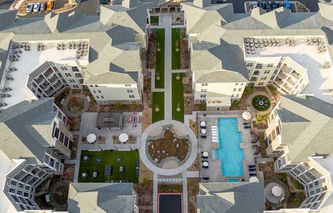 A bird's eye view of a courtyard surrounded by buildings.
