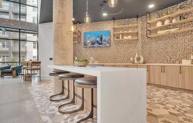 a restaurant with a white counter and stools in a lobby