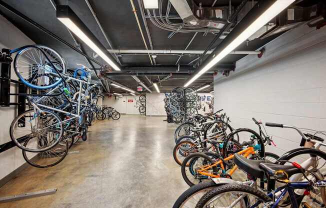 A bike rack full of bikes in a room.