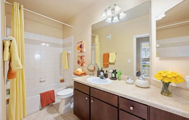 Ensuite bahtroom with wooden cabinetry