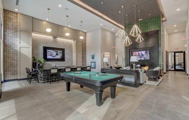 play a game of pool in our clubhouse at our apartments