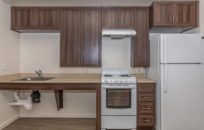 a kitchen with a stove top oven sitting inside of a refrigerator