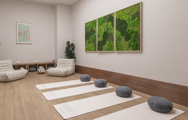 Elevate your wellness routine at Mabel with our serene yoga studio. Enjoy a tranquil atmosphere and stylish decor designed for relaxation and rejuvenation. Unwind and recharge in your new home. Schedule your visit today!