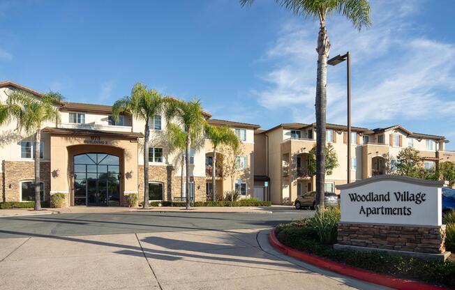 a building that has a sign on the side of a road