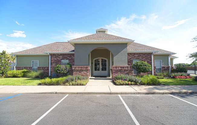 an empty parking lot in front of a house