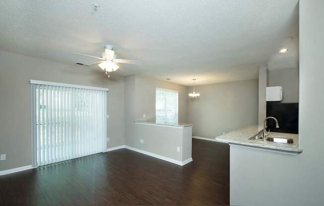 Spacious living areas with ceiling fans and overhead lighting (Signature)