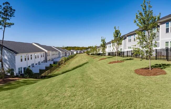 Expansive community greenspaces feature landscaped lawns, shade trees, and open areas that provide residents with additional room to relax, recreate, and enjoy the outdoors close to home.