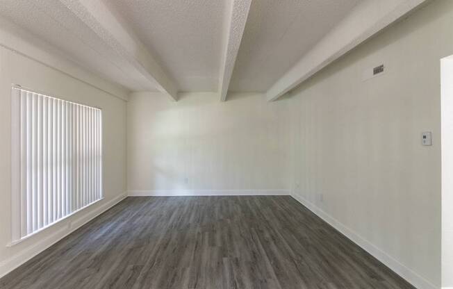 A dining room with a white ceiling fan in a 2 bedroom, 1 bath apartment home at Harvard Square Apartments in the Vickery Midtown neighborhood of Dallas, TX.