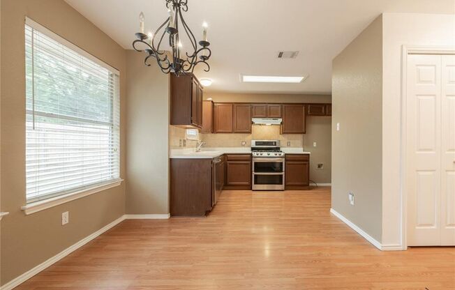No Carpet! Tons of Space! Beautiful backyard with large covered patio!