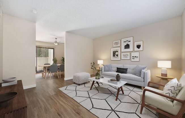 The entrance view of the living room and dining room to the townhome floor plan at Silverstone Apartments.