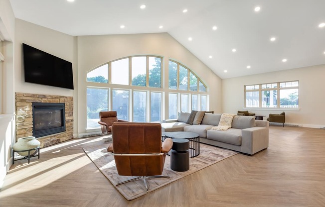 a living room with a couch and a chair and a fireplace at Copper and Quarry Village, Maryland, 21209