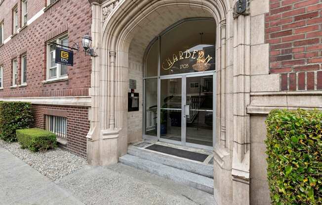 a view of the front of the building from the sidewalk at Charbern Apartment Homes, Seattle, 98122