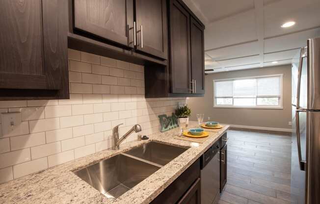 Kitchen with granite counters and stainless appliance