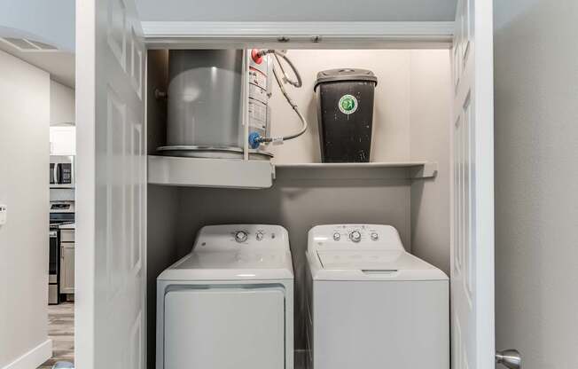 A laundry room with a washer and dryer in it.