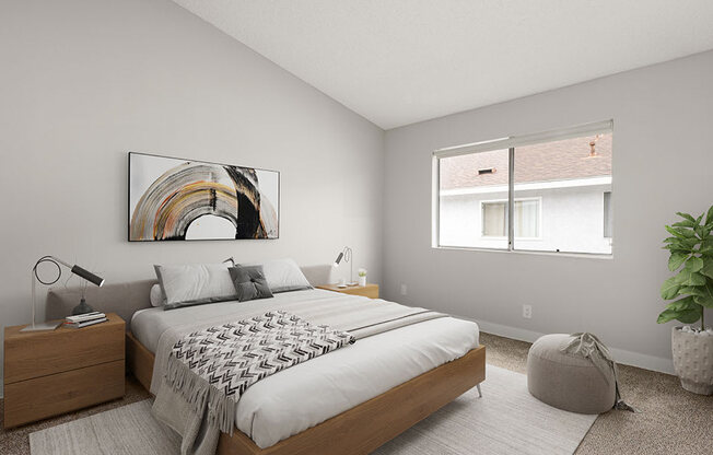 Carpeted bedroom with natural light windows.