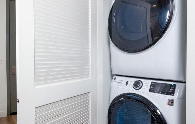 a laundry room with a washer and dryer in a closet