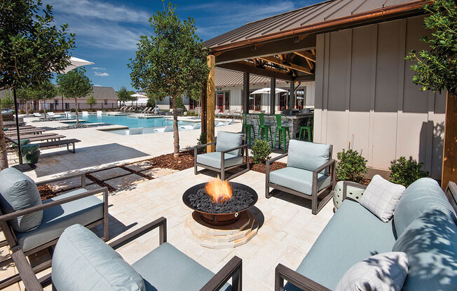 fire pit with seating on the pool deck