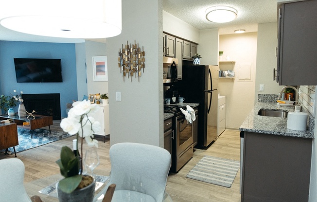 a view of the kitchen and living room from the dining room