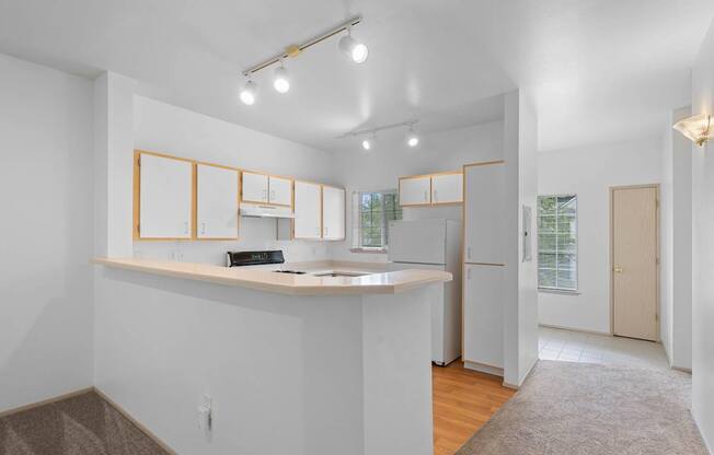 a kitchen with a counter top and a refrigerator