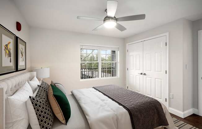 a bedroom with a large bed and a ceiling fan