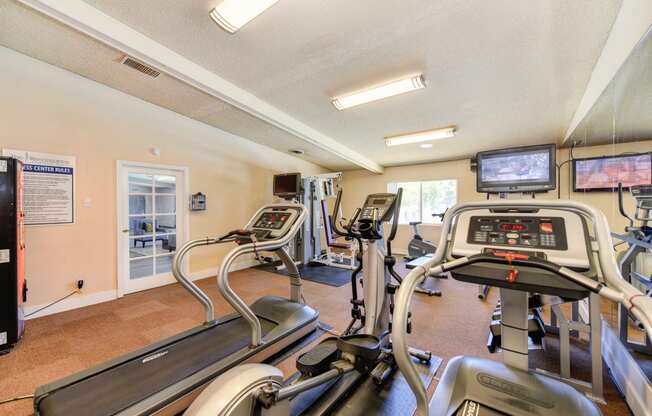 Fitness Center with Treadmills, Tv and Vending Machine.
