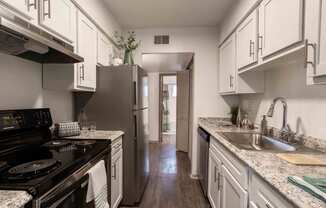 The Jaunt Apartments in Charleston South Carolina photo of kitchen with white cabinets