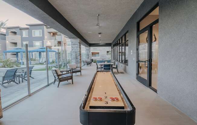 Shuffle board table located at the community patio