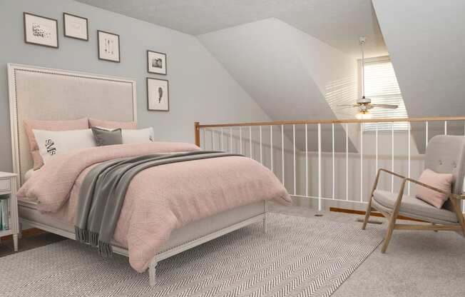 Loft bedroom with slanted ceilings, railing and bed with pink sheets