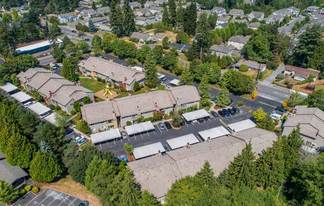 an aerial view of a neighborhood with houses and trees at Quartz Creek, Washington, 98043