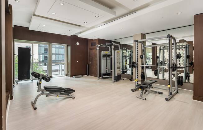 a workout room with weights and other gym equipment