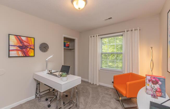 a living room filled with furniture and a flat screen tv