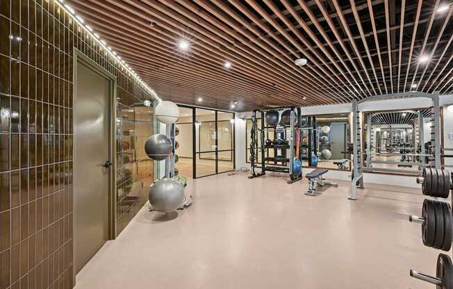 State-of-the-art Fitness Center with a variety of equipment including weights and machines.