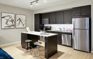 4Marq - Kitchen with Island and Stainless Steel Appliances