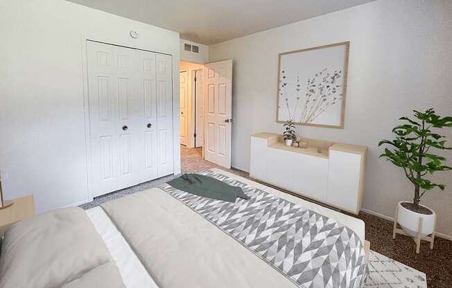 a bedroom with a bed and a plant and a closet
