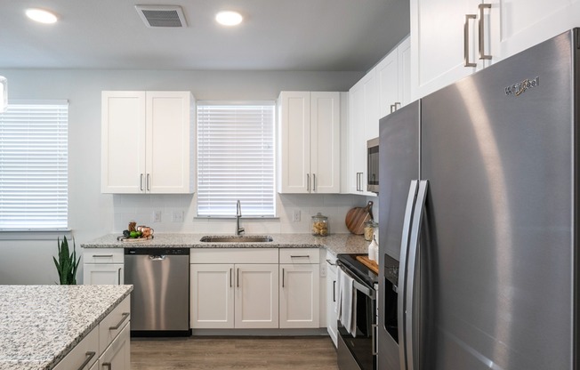 Elevate your kitchen experience with Modera Georgetown's ENERGY STAR® stainless steel appliance package. From the double-door refrigerator with a water and ice maker, every detail is crafted for modern living.