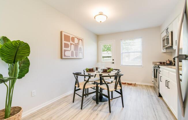 Kitchen dining table set and patio door with mini blinds included at The Arbor in Blue Springs, MO