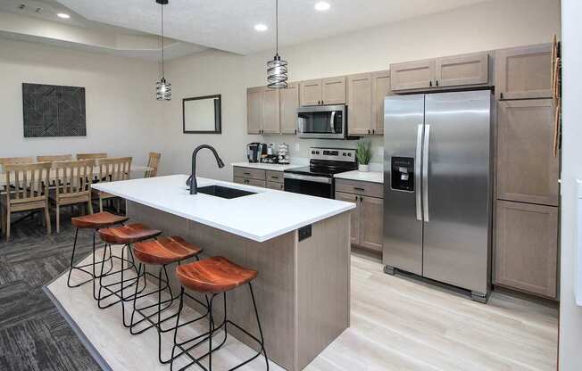 A modern kitchen with a bar stool.