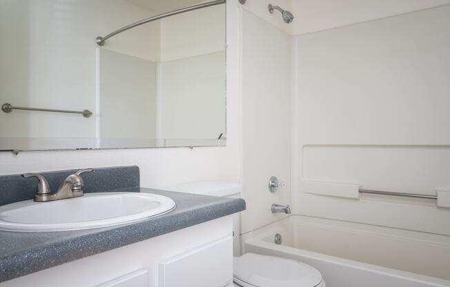 a bathroom with a sink toilet and bathtub