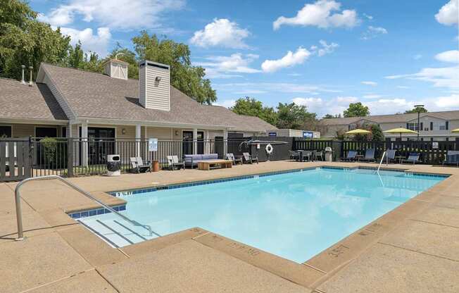 A large swimming pool with a slide in the middle of it.