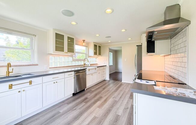 Beautiful recently remodeled 4 bed 2 bath home. Perfect for multi generational living with second kitchen in basement!