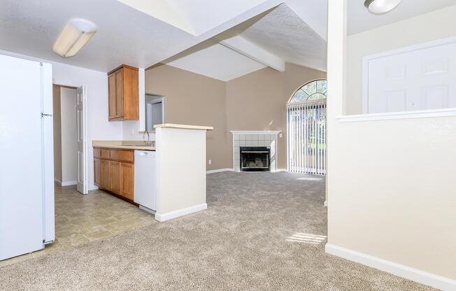 a kitchen with a refrigerator in a room