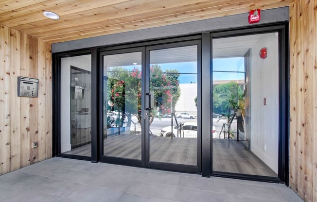 a sliding glass door in a wooden building